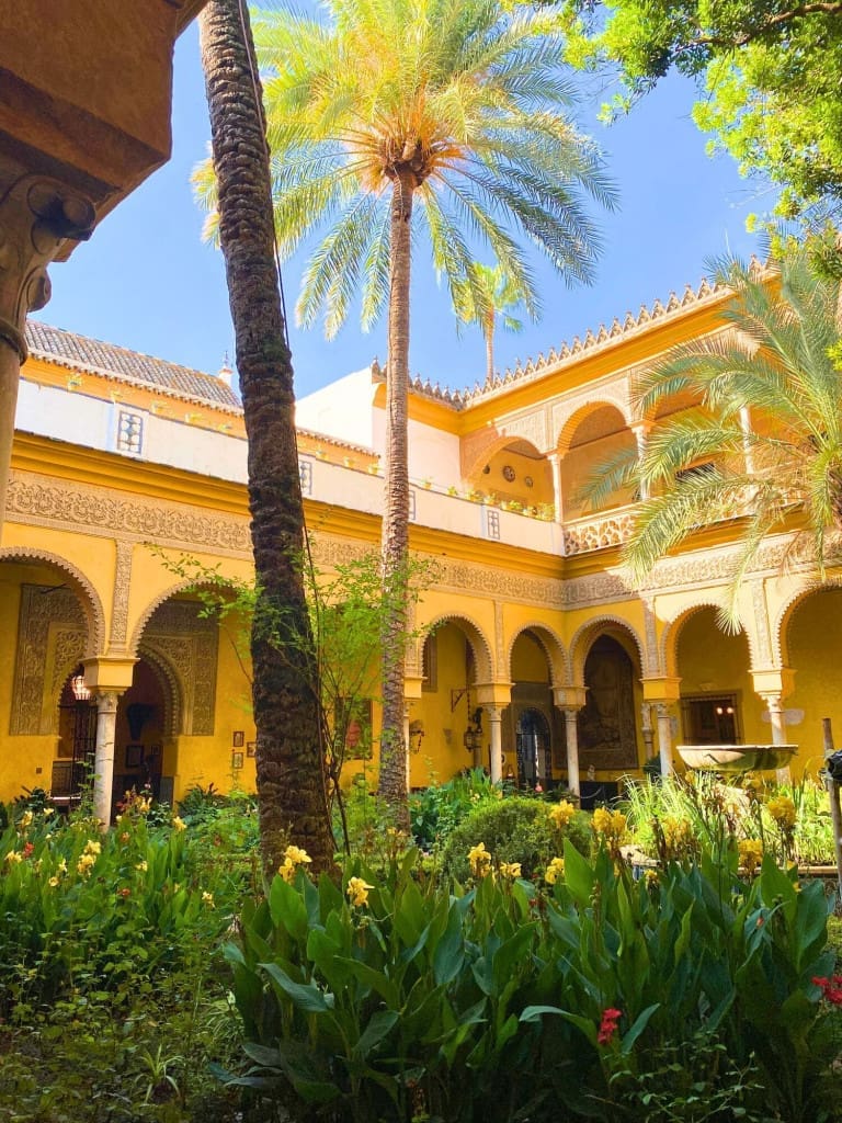 14 of the Top Things to Do in Seville, Spain, on Your First Trip 36 courtyard palm palacio de las duenas seville