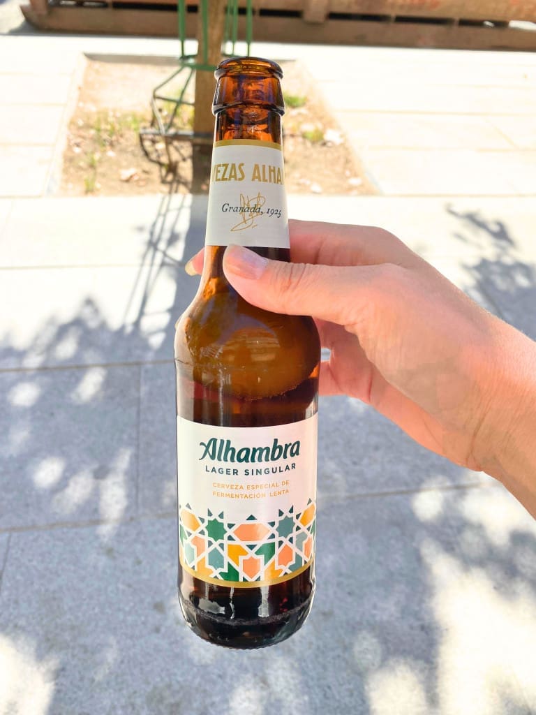 Is Granada, Spain, Worth Visiting? Yes, Here's How I Took a Day Trip 37 hand bottle alhambra lager singular beer granada