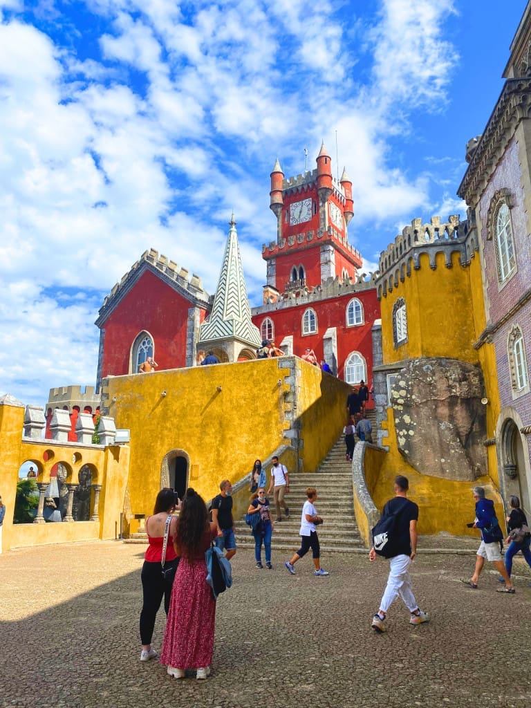 The Top Things to Do in Sintra: 5 Stunning Palaces You Need to See 15 people clocktower pena palace sintra