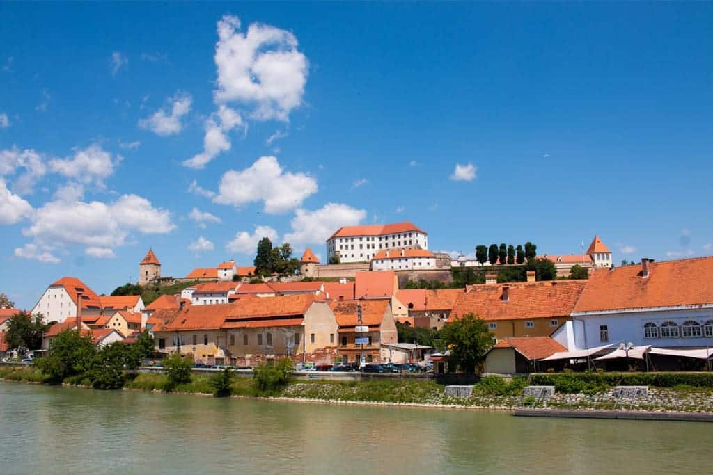 18 of the Best Things to Do in Slovenia: Your Ultimate Travel Guide 11 ptuj castle drava river slovenia