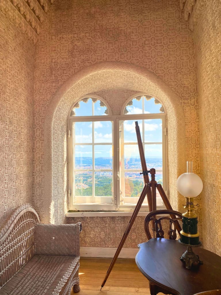 The Top Things to Do in Sintra: 5 Stunning Palaces You Need to See 10 telescope arched window pena palace sintra