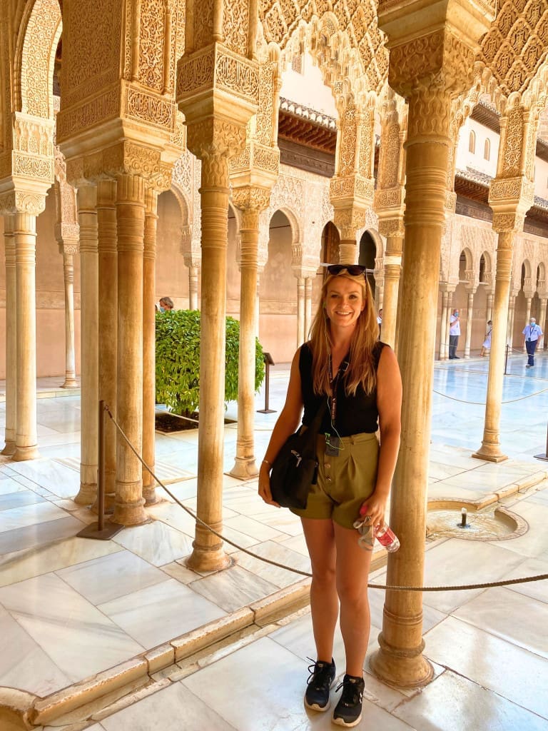 Is Granada, Spain, Worth Visiting? Yes, Here's How I Took a Day Trip 33 woman court lions nasrid palaces alhambra granada