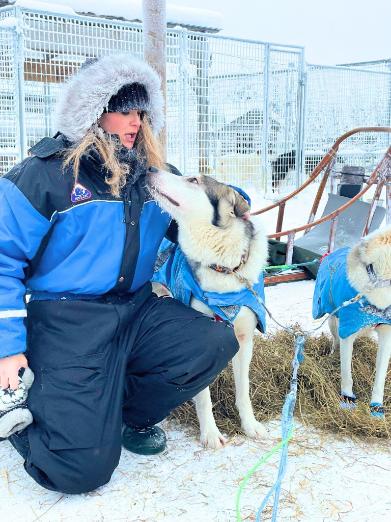 Rovaniemi in Winter: How to Build a First-Timer's Itinerary for Finnish Lapland 49 husky sled ride woman dog lapland finland