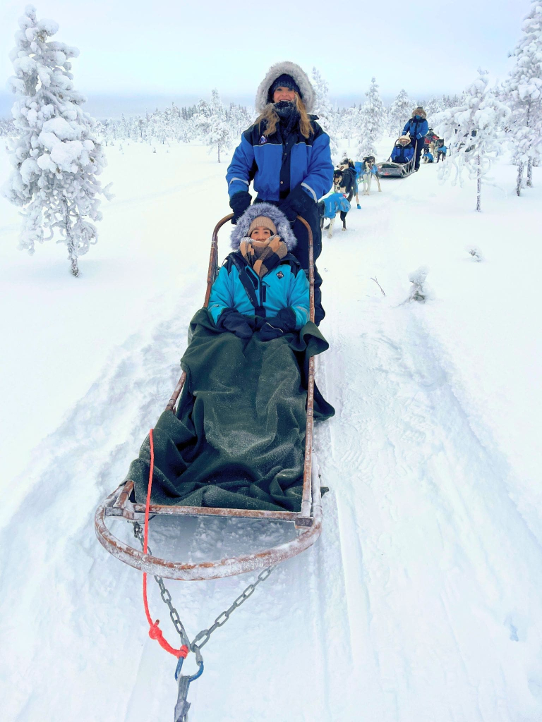 Rovaniemi in Winter: How to Build a First-Timer's Itinerary for Finnish Lapland 47 husky sled ride women lapland finland