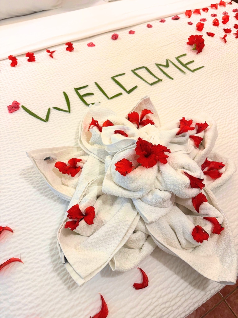 X'tan Ha Resort: Review of My Stay at Ambergris Caye, Belize's Hidden Gem 10 welcome flowers bed xtan ha resort ambergris caye belize